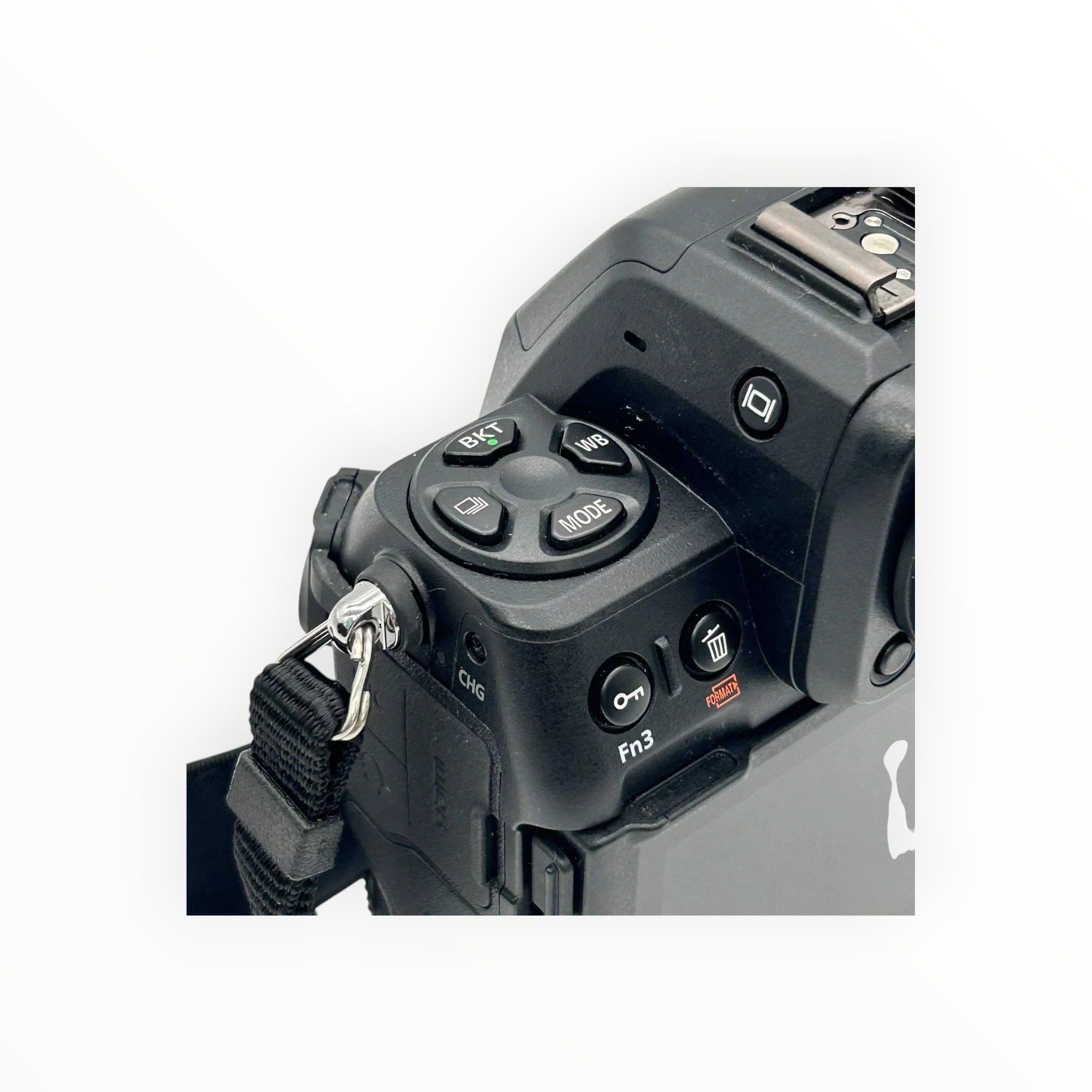 Cymer Nikon Z8 mirrorless camera top control dial and function buttons showing BKT, WB, and mode settings