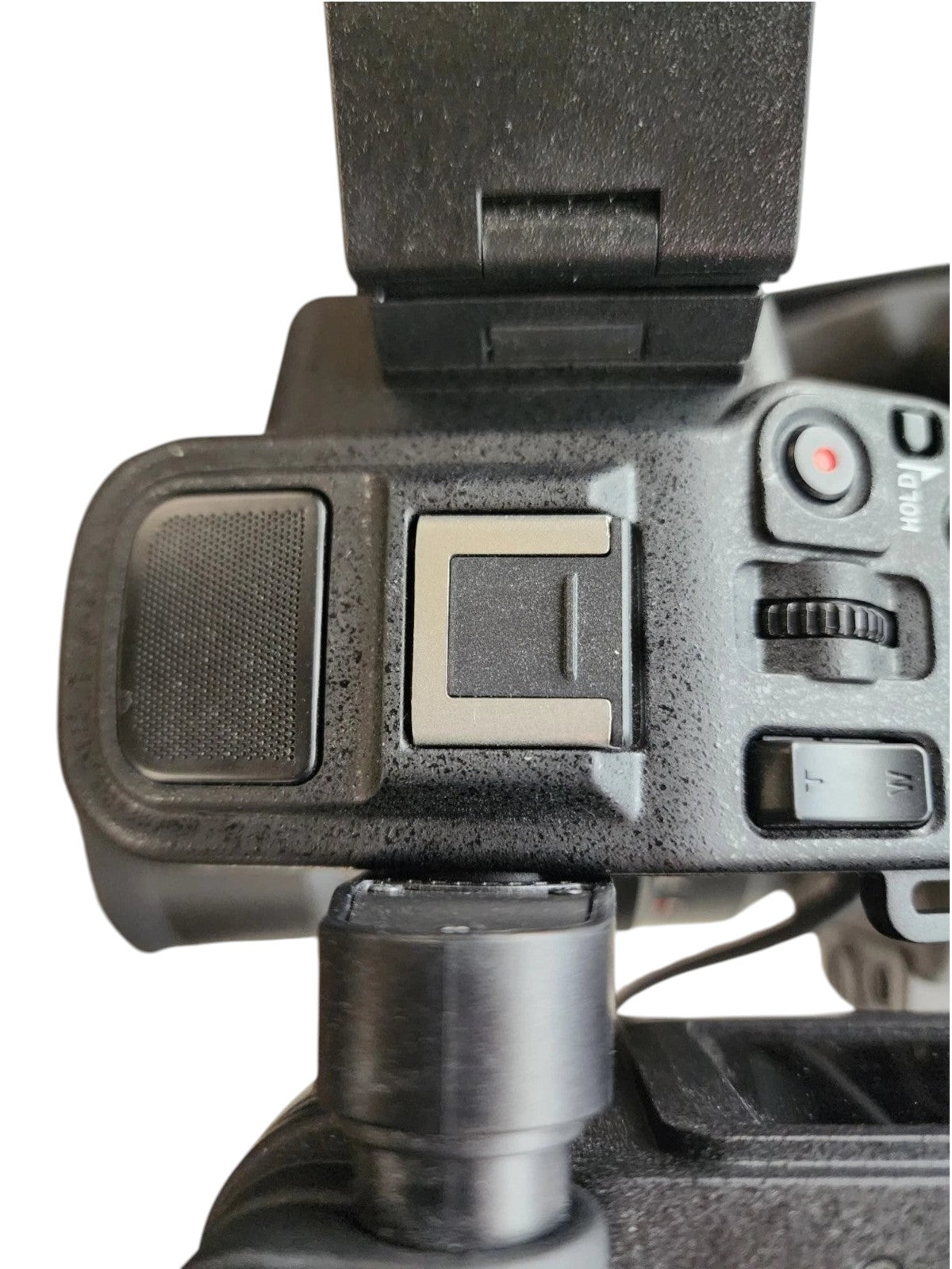 Top view of the Cymer Sony FX6 cinema camera handle showing the hot shoe mount, record button, and zoom toggle.