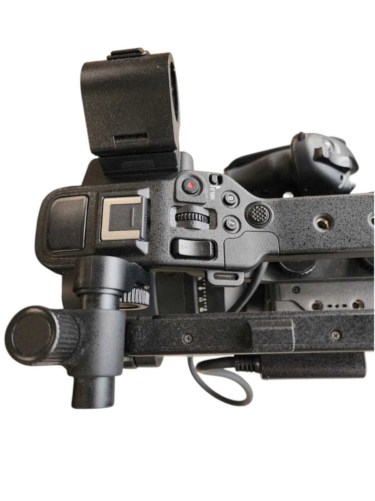 Top view of the Cymer Sony FX6 cinema camera showing the ergonomic handle, control buttons, and modular rig components.