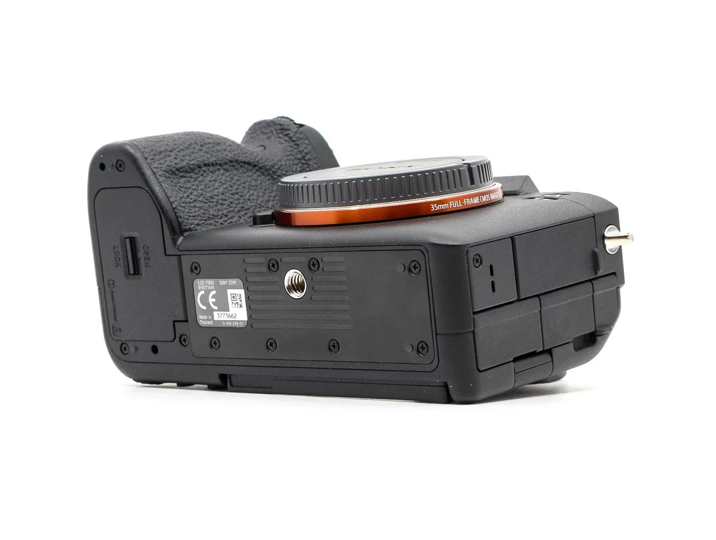 Cymer Sony Alpha full-frame mirrorless camera body, bottom view showing tripod mount and lens mount detail.
