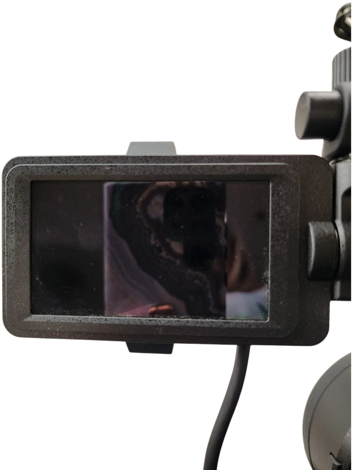 Cymer Sony FX6 cinema camera LCD monitor screen displaying a reflective surface in a professional studio setting